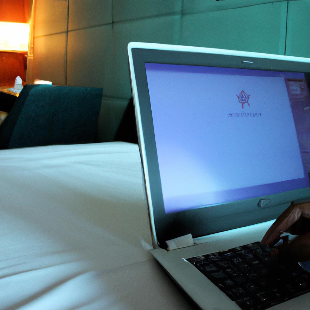 Person using laptop in hotel